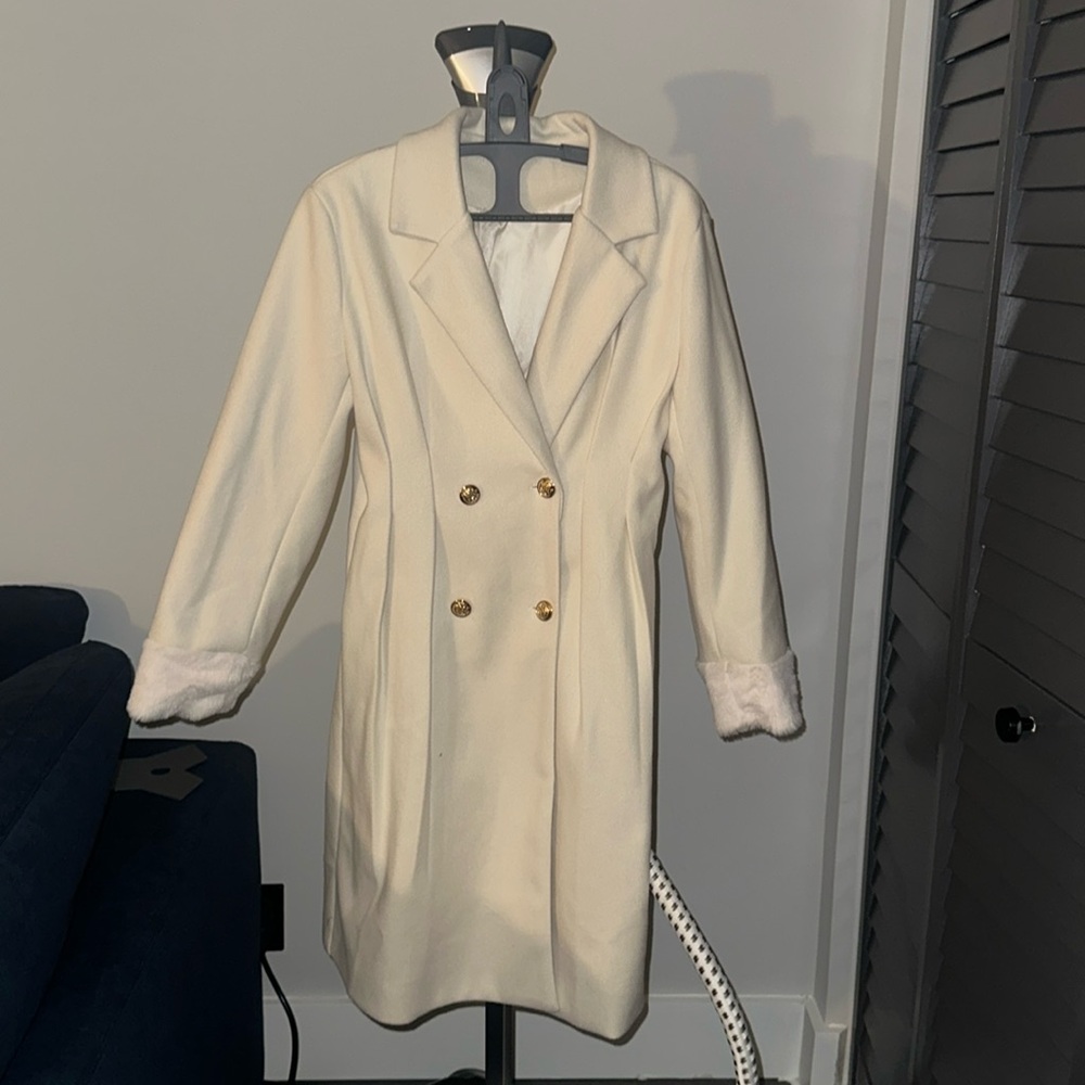 Cream bottomed Coat, mid length knee length never worn